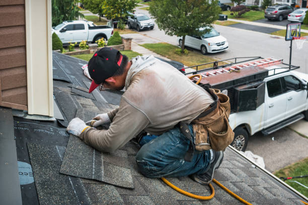 Professional Storm Damage Roof Repair technician working in Warfield, VA